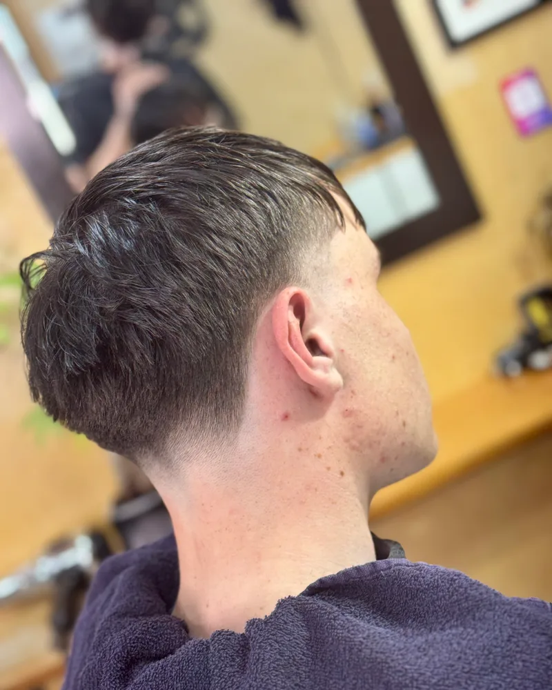 Back view of a French crop with a straight fringe and a tapered neckline
